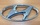 ЭМБЛЕМА РЕШЕТКИ РАДИАТОРА HYUNDAI SOLARIS (11-14) ОРИГИНАЛ